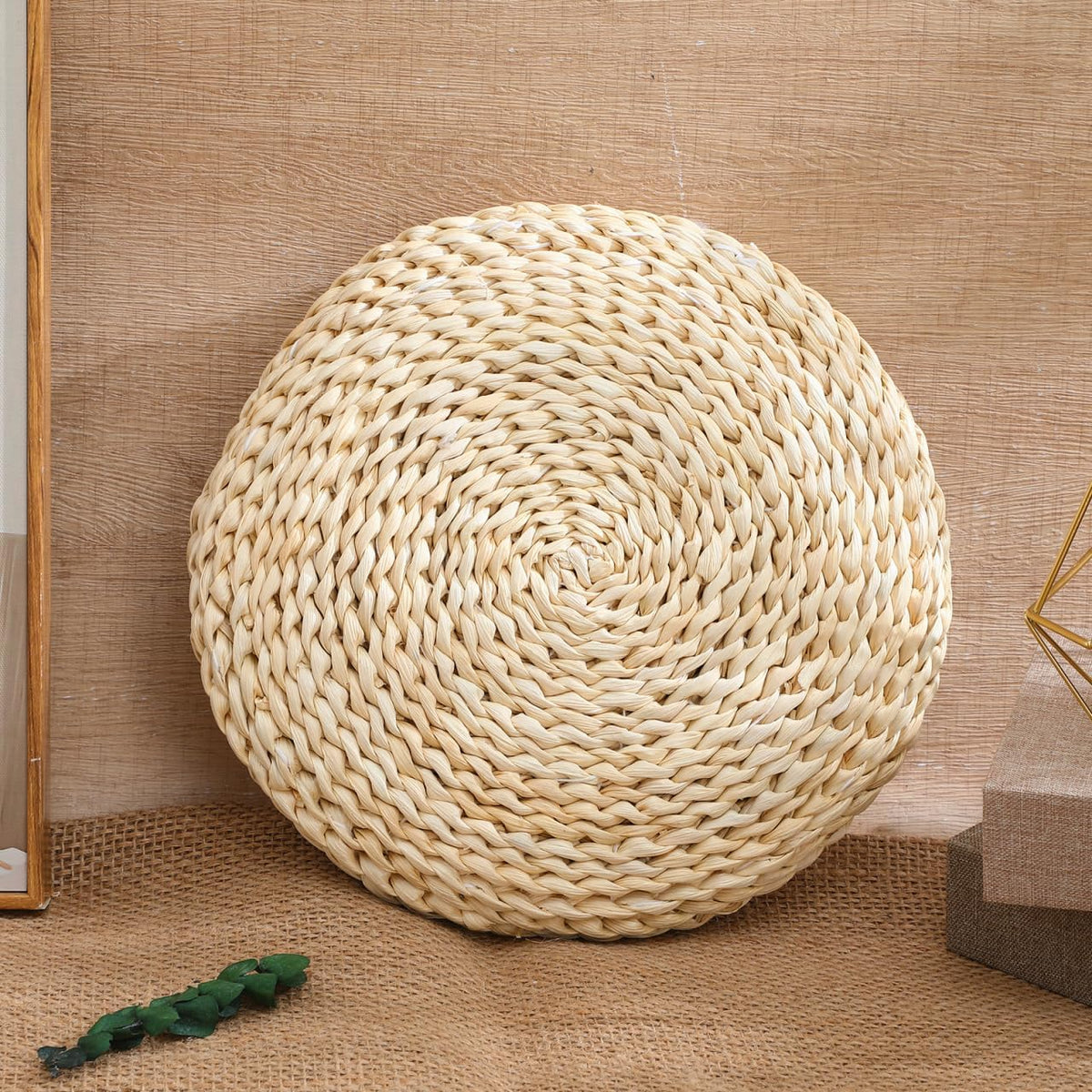 The cushion against a wooden wall, on woven matting