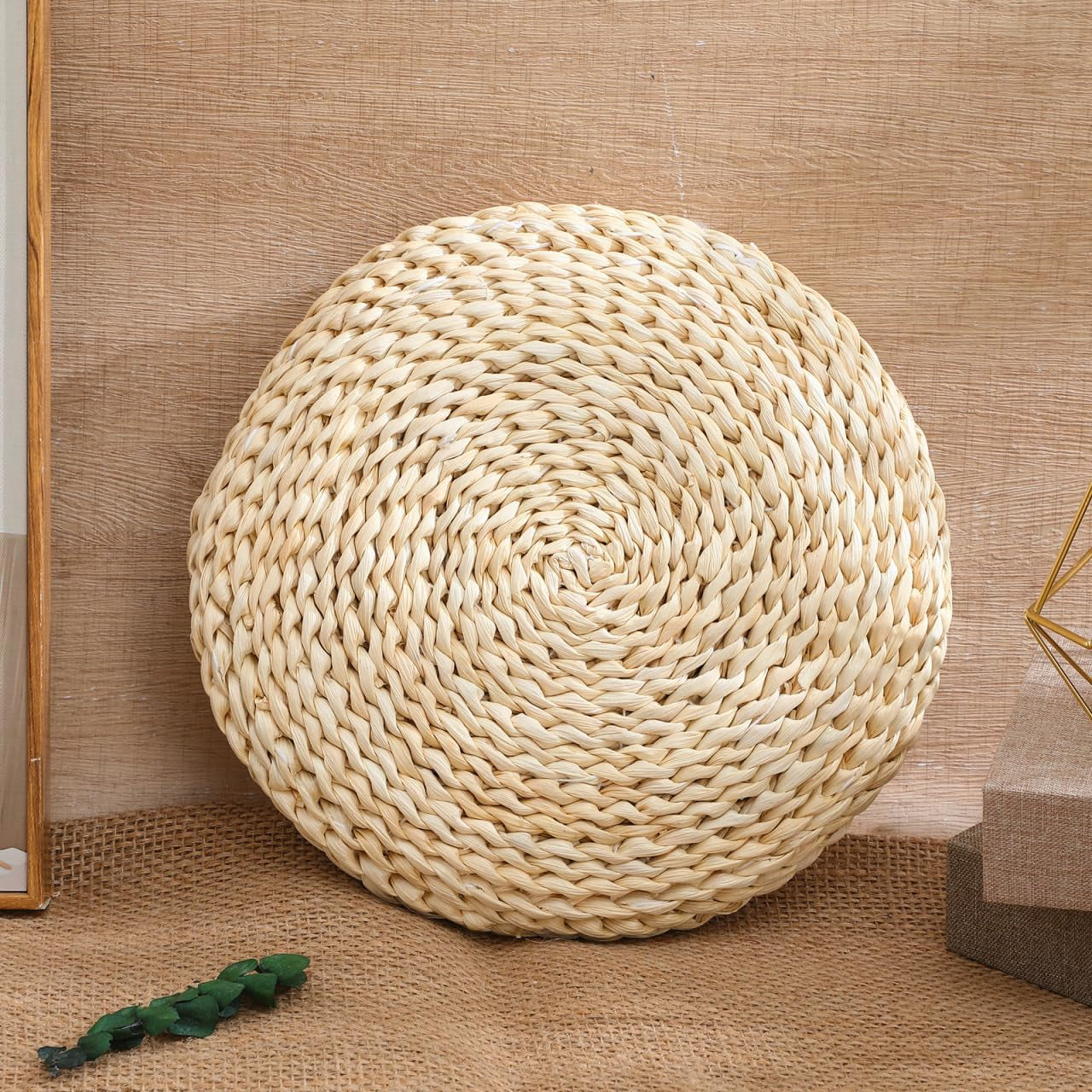 The cushion against a wooden wall, on woven matting